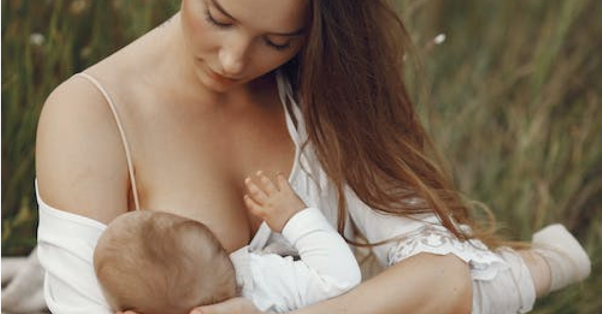 Pregnant woman breast feeding