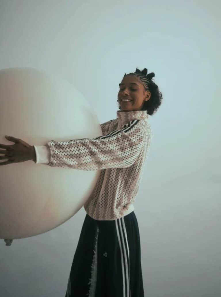 Smiling woman holding a big balloon